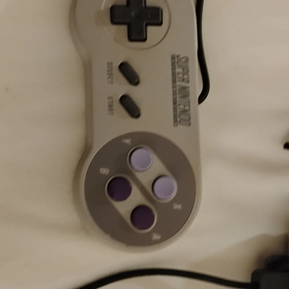 Nintendo Console with Gray and Purple Design